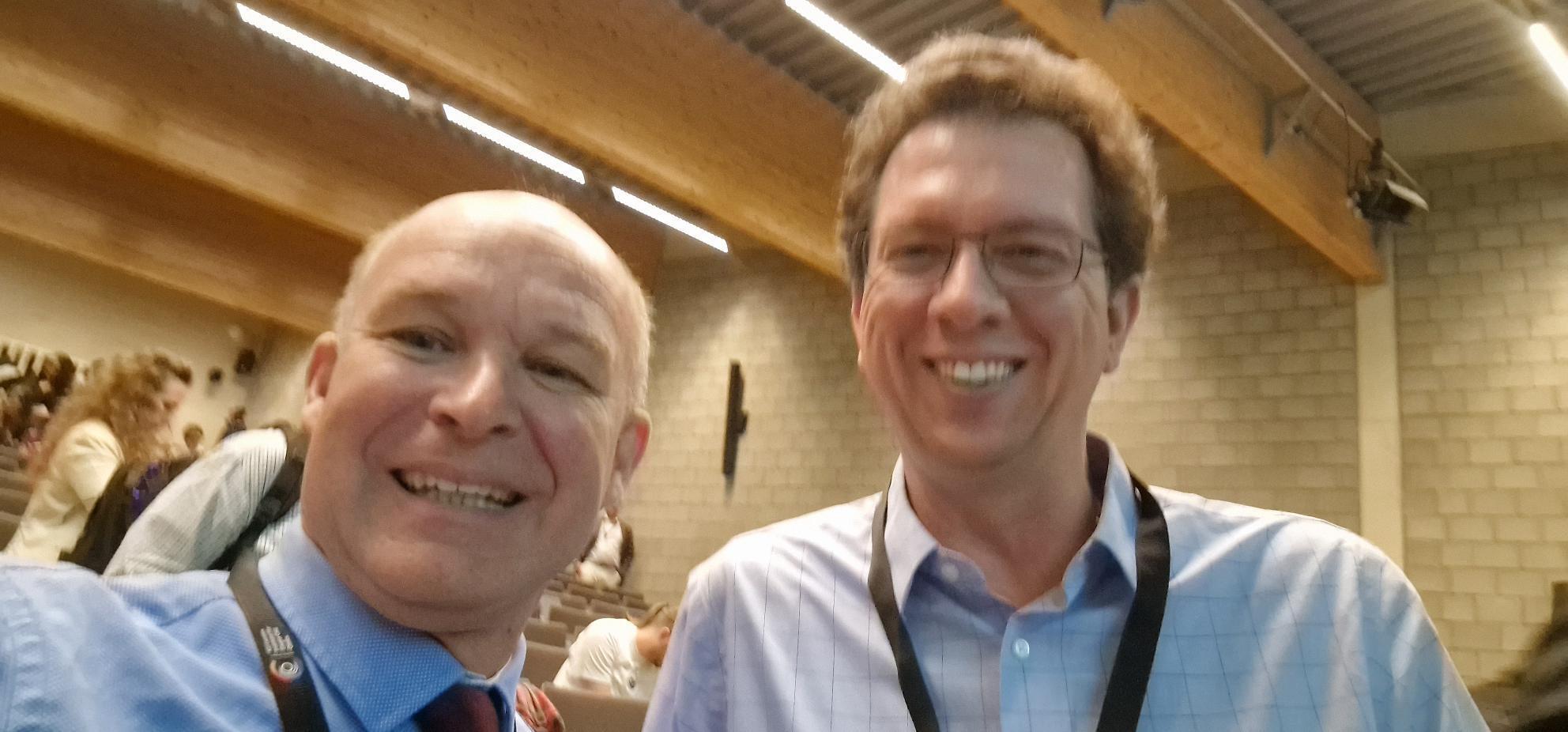 Lieven Gevaert engaging with Nicholas Navin during the Q&A session at SCSOmics 2025, focusing on copy number alterations in ductal carcinoma in situ (DCIS).